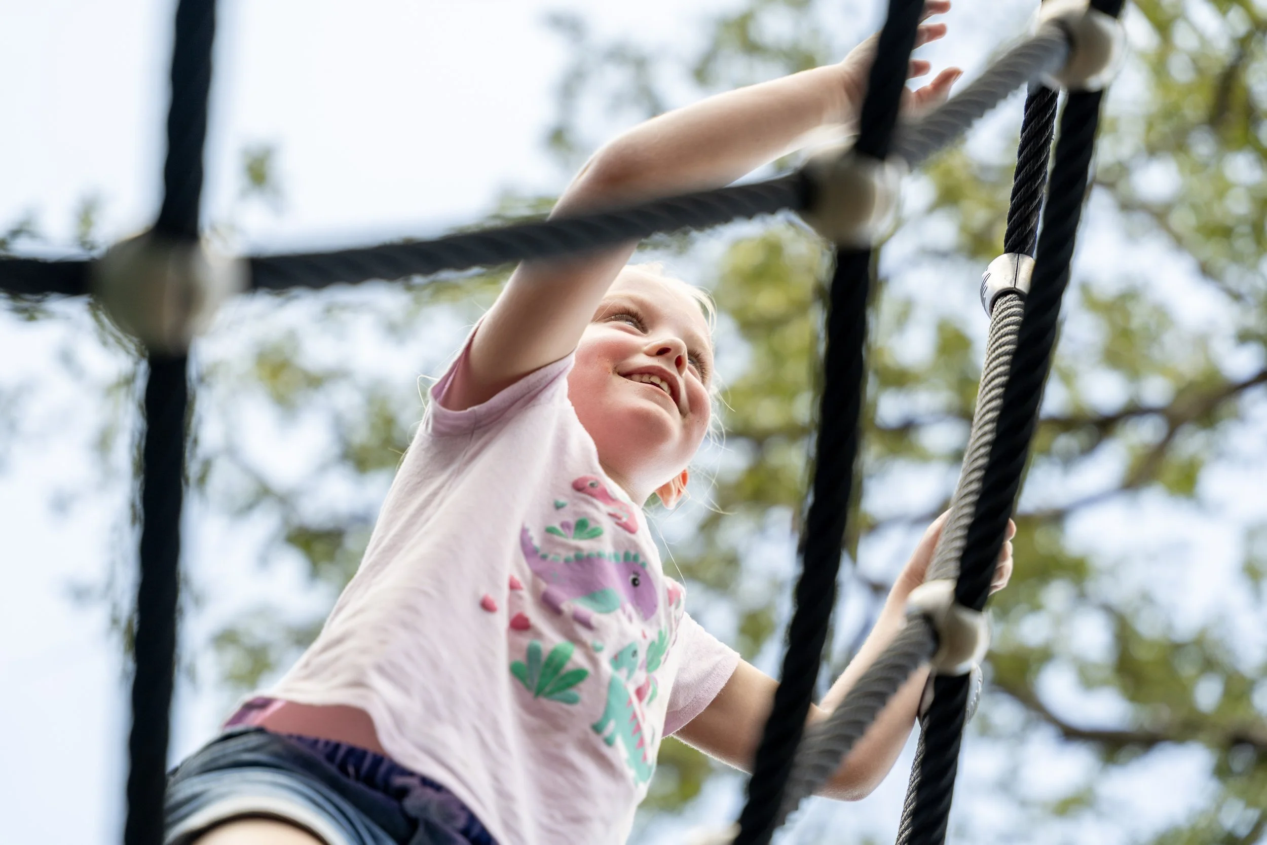 54commercial playground, girl climbing on playground rope climber, playground photography.jpg