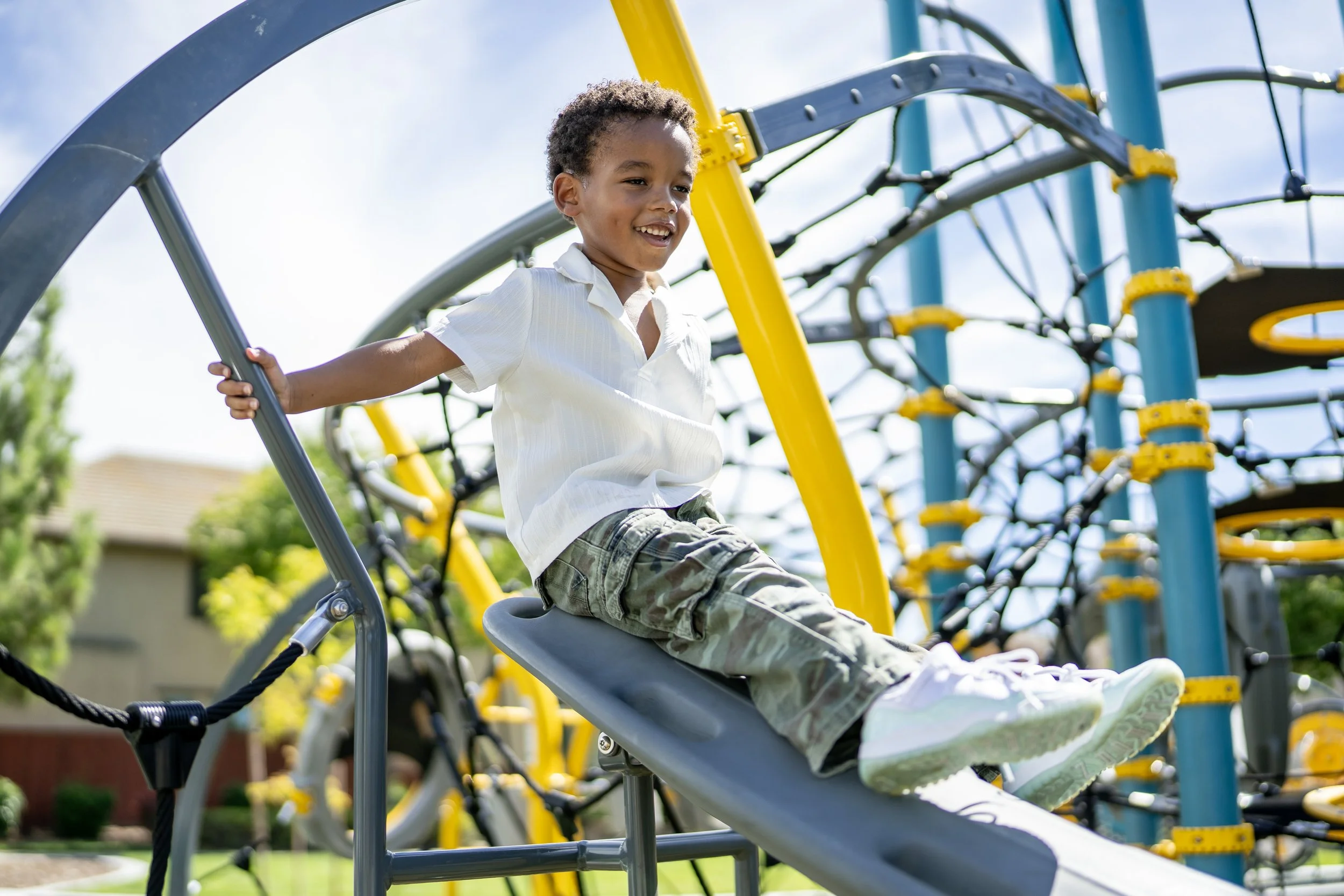36boy on playground, commercial playground, custom playground, playground photography.jpg