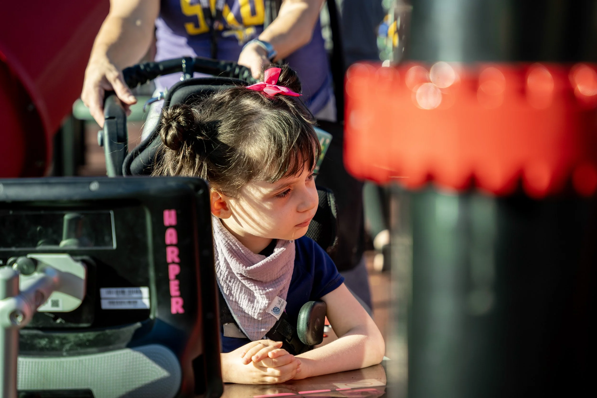 21girl in wheelchair playing on playground, inclusive play.jpg