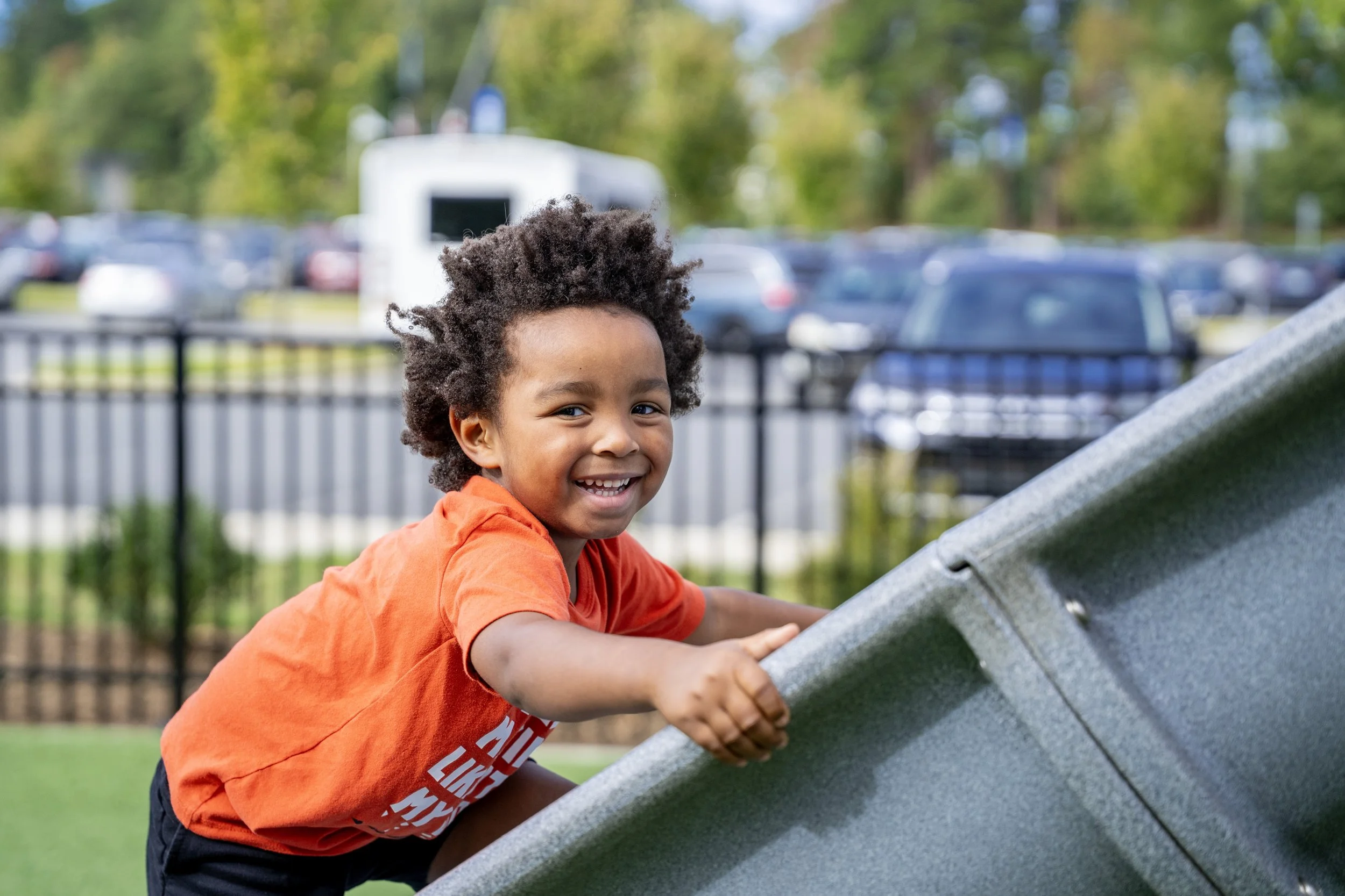 15boy climbing up a slide.jpg
