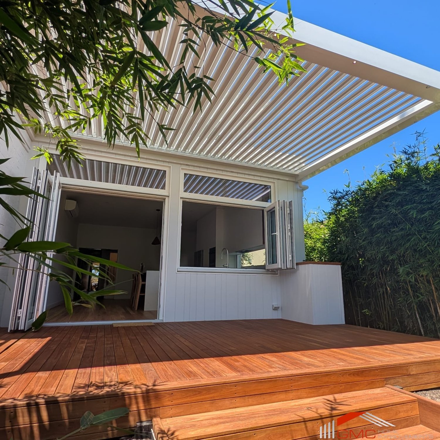 Premium GMC motorised louvre roof fully open over an outdoor entertaining area