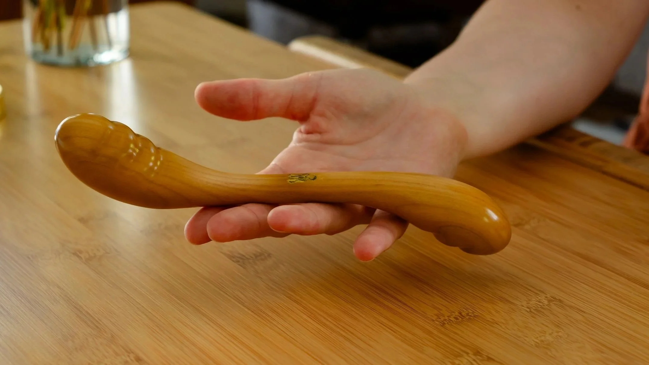 Sensual Desire twist dildo in a palm.