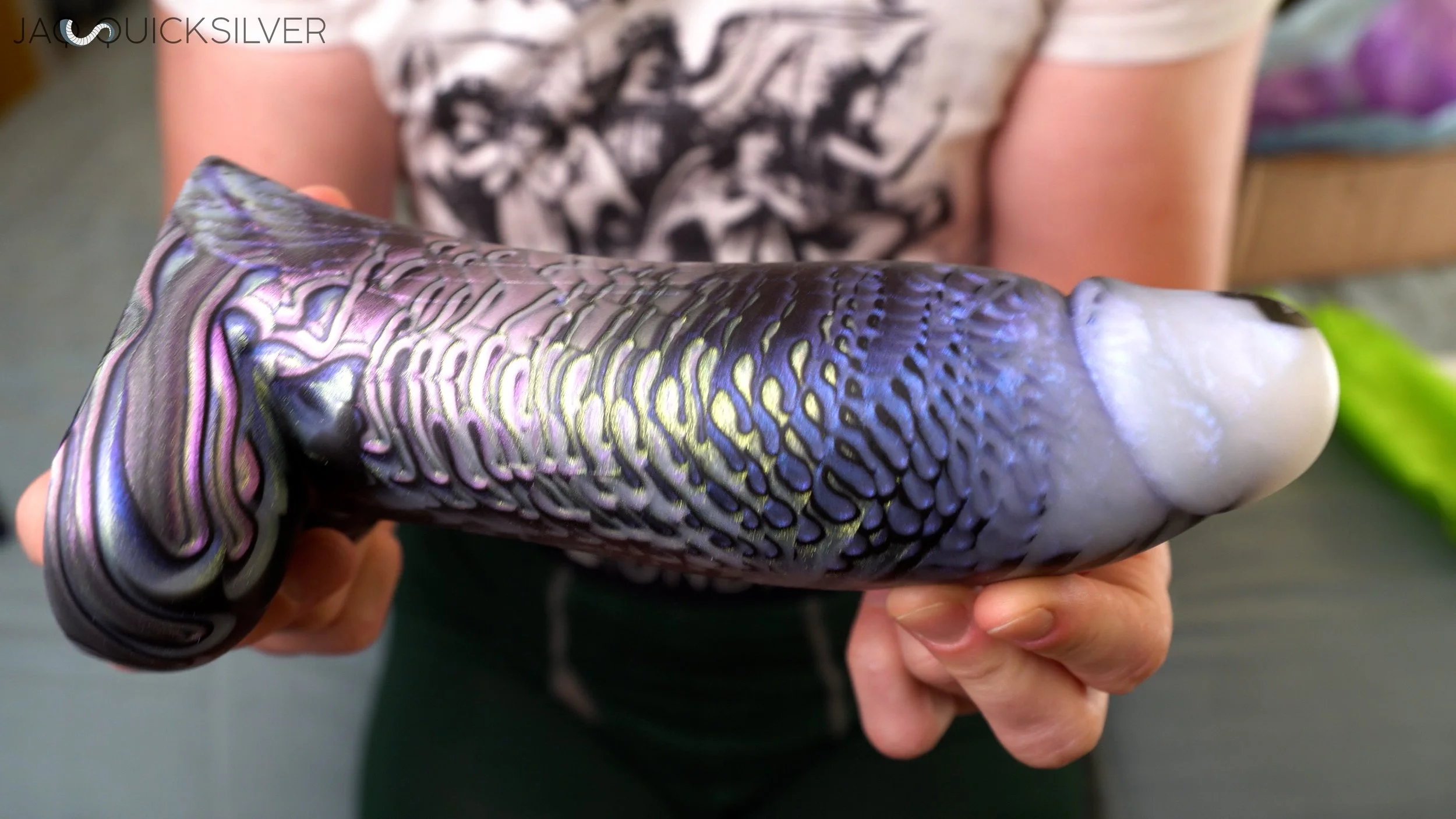 Jaq holding the PPS Tellus dildo.
