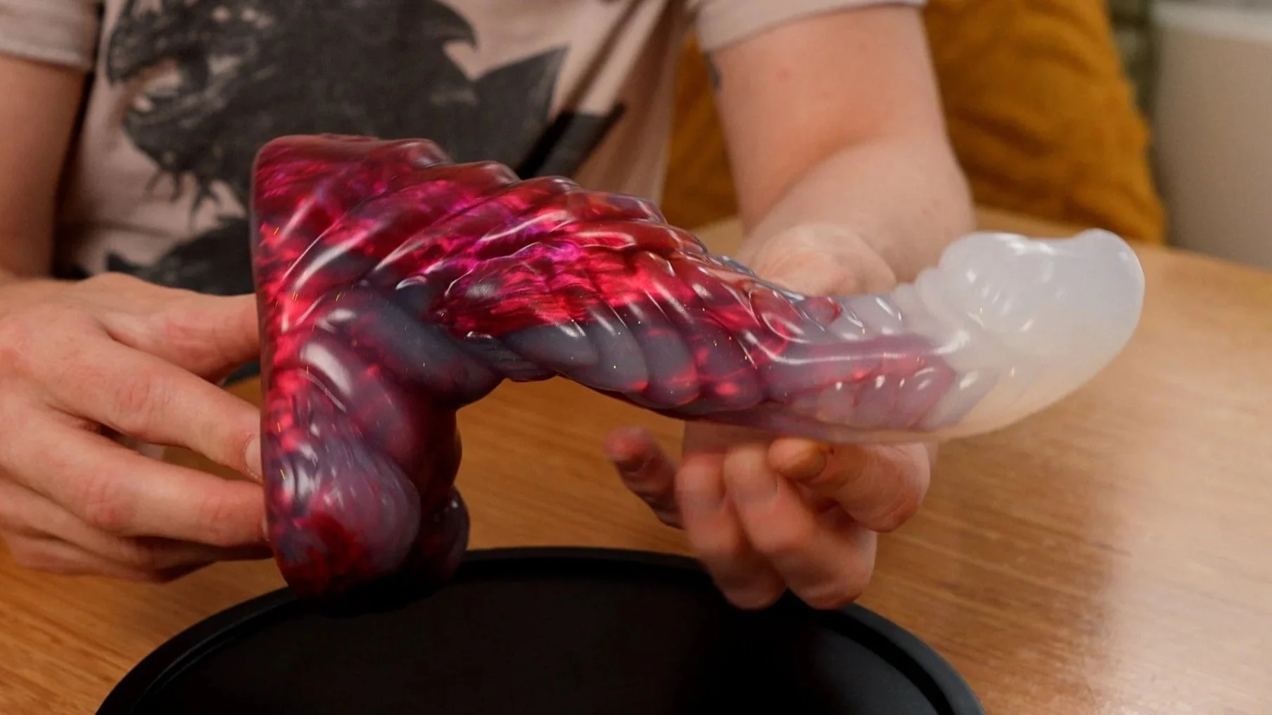 SquidlyCo mothman dildo held by Jaq Quicksilver