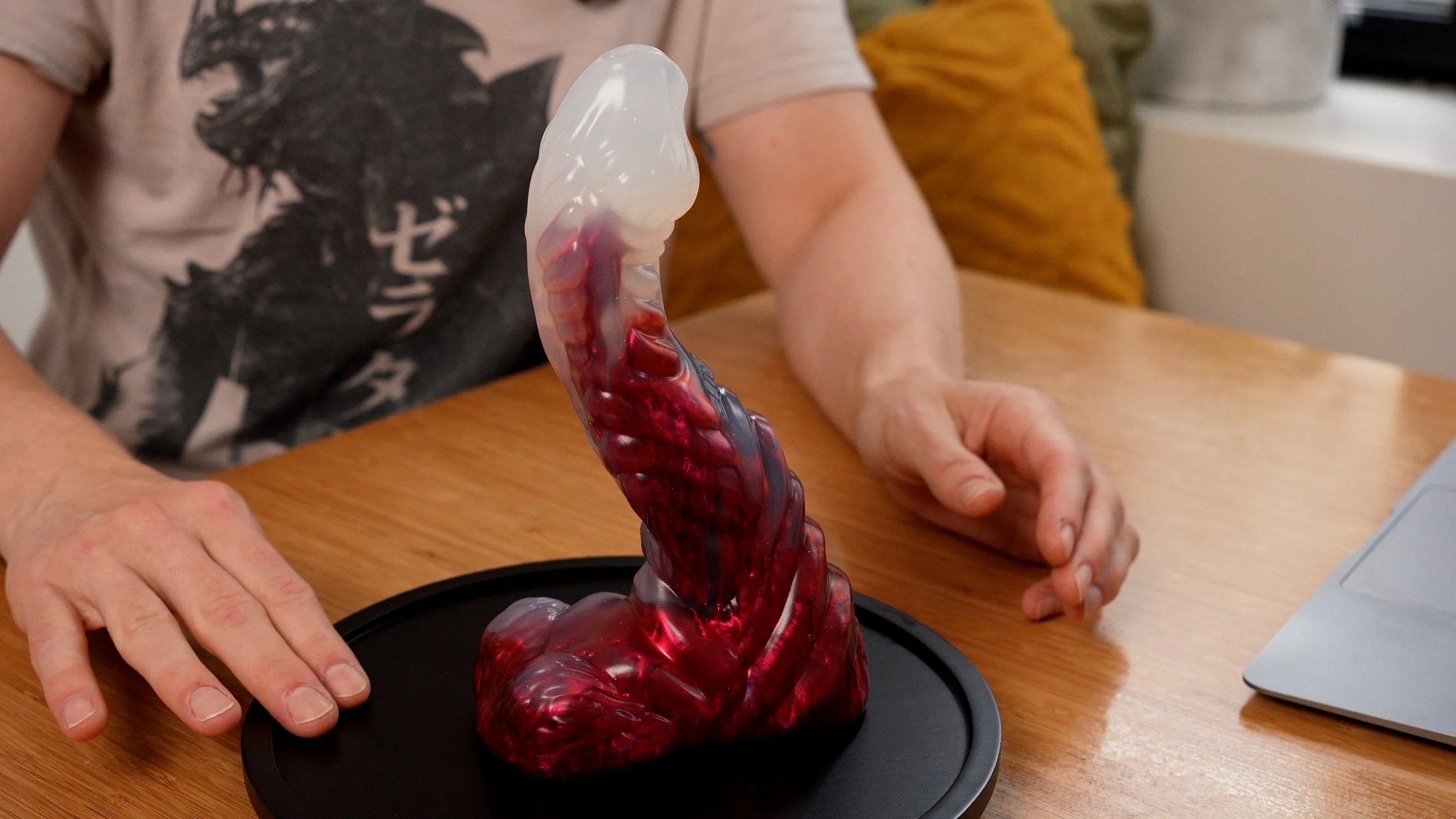 SquidlyCo Mothman dildo in near-clear and sparkling red.