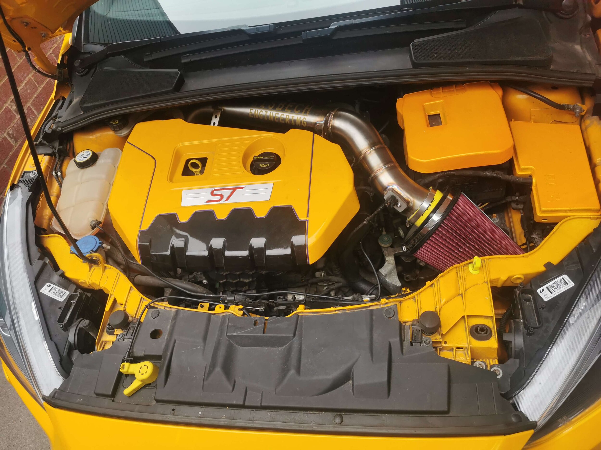Yellow modified Ford Focus ST250 engine bay.jpg