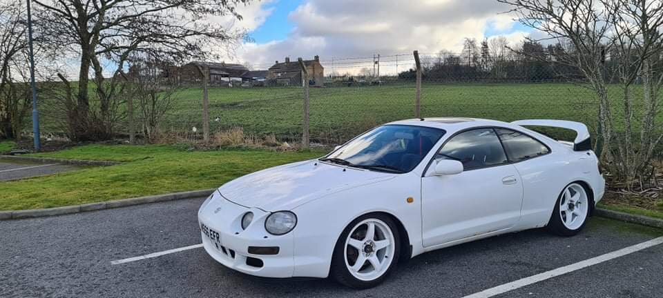 White modified Toyota Celica nearside front in a parking space.jpg