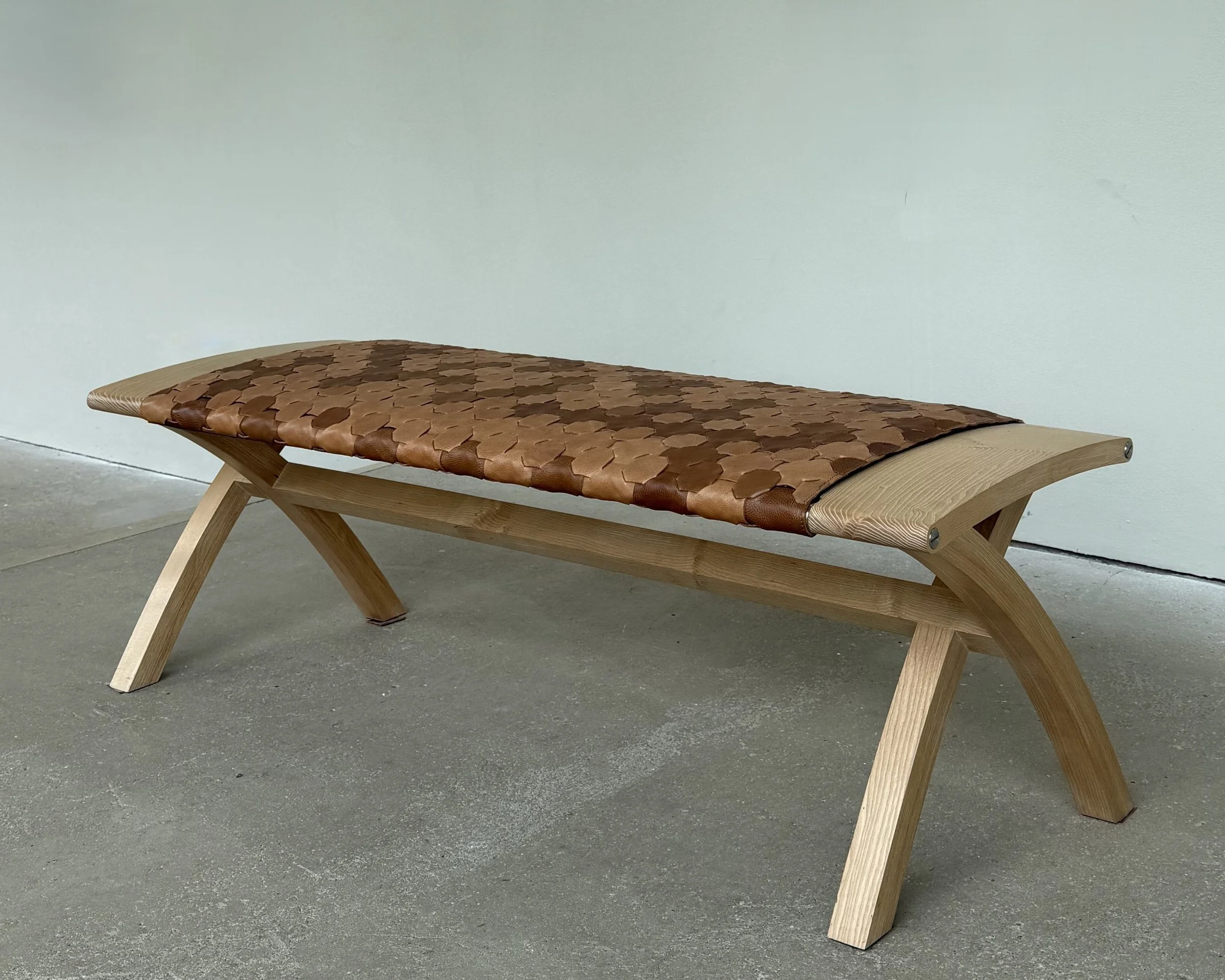 Katie Walker, Beam Bench, 2020, Ash finished with an Osmo hard wax oil, stainless steel fixings and an Elvis & Kresse rescued caramel leather cover, 46 x 137 x 50 cm. 