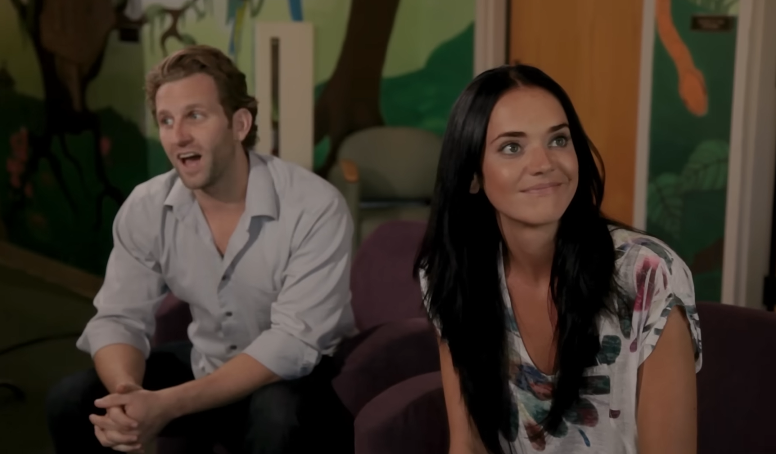 screenshot of the white couple, Rich and Lynn Thomas, from the 2012 film PARANORMAL ADOPTION. They appear incredulous when Lacy, their new adoptive daughter, tells them her doll, Miss Rachel, "is a real person."