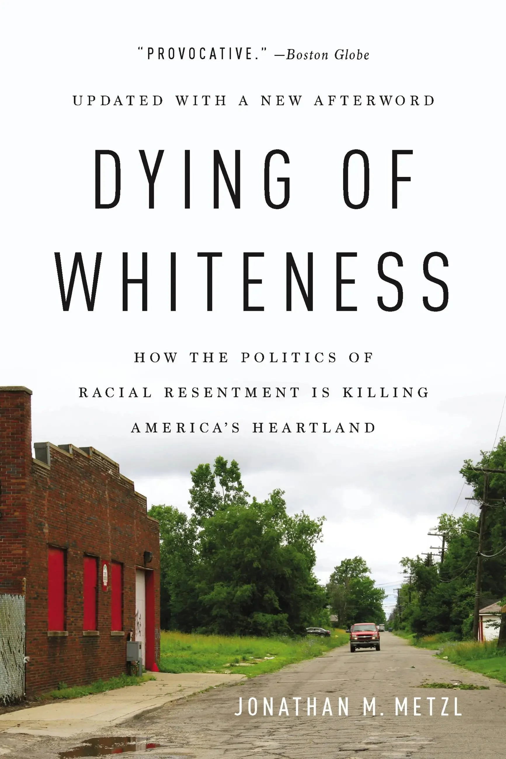 Cover for Dying of Whiteness by Jonathan M. Metzl. Features a photograph of a dilapidated town street somewhere in America.