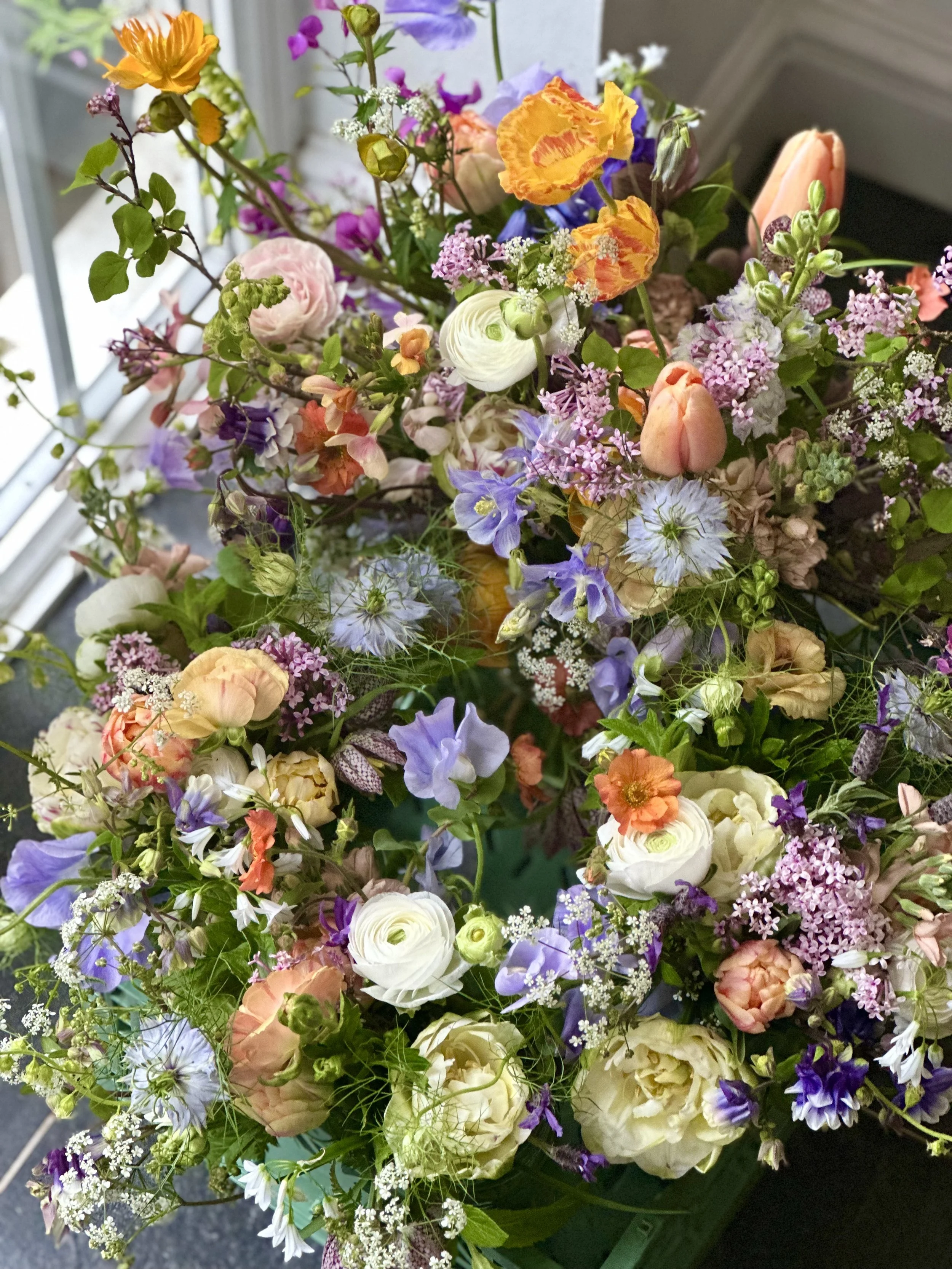 Purple, peach and orange wedding flowers