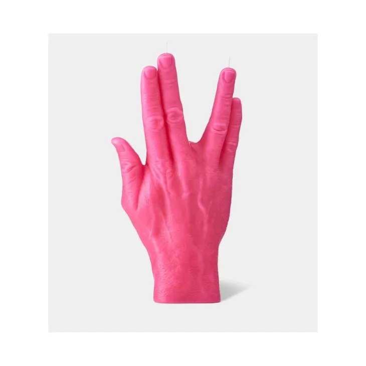 A pink candle shaped like a human hand making a peace sign, with the two fingers raised and the other fingers folded down.