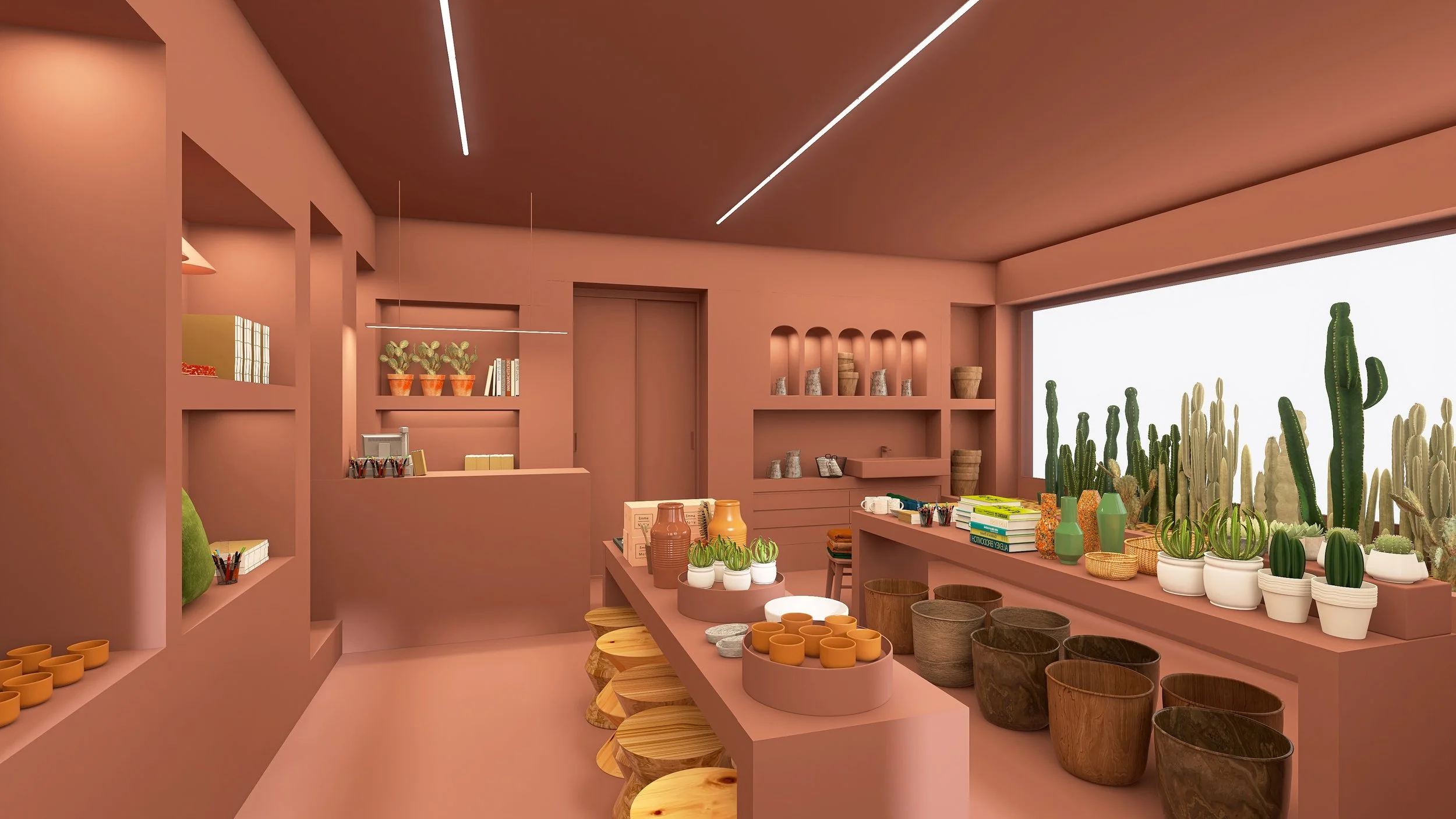 Tienda con diseño interior en tonos terracota, decorada con plantas de cactus, macetas de cerámica. Estantes exhiben libros y objetos decorativos. The Cactus Shop, diseño de interiorismo y visual merchandising. Agosto Creative Studio.
