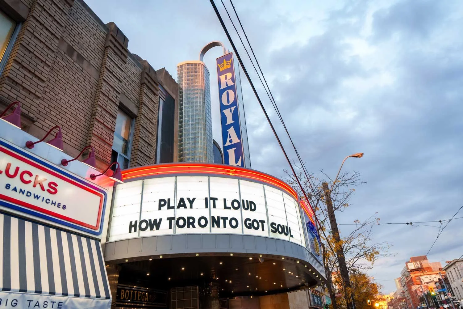 The marquee sign on a theater in Toronto with the message: "Play it loud, how Toronto got soul," and a vertical sign reading "Royal".