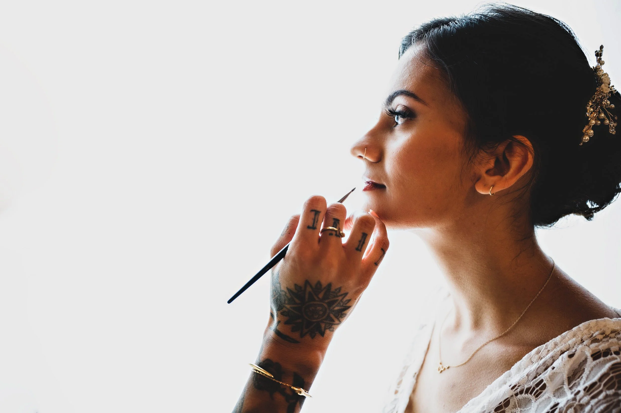 Bride getting her wedding makeup done