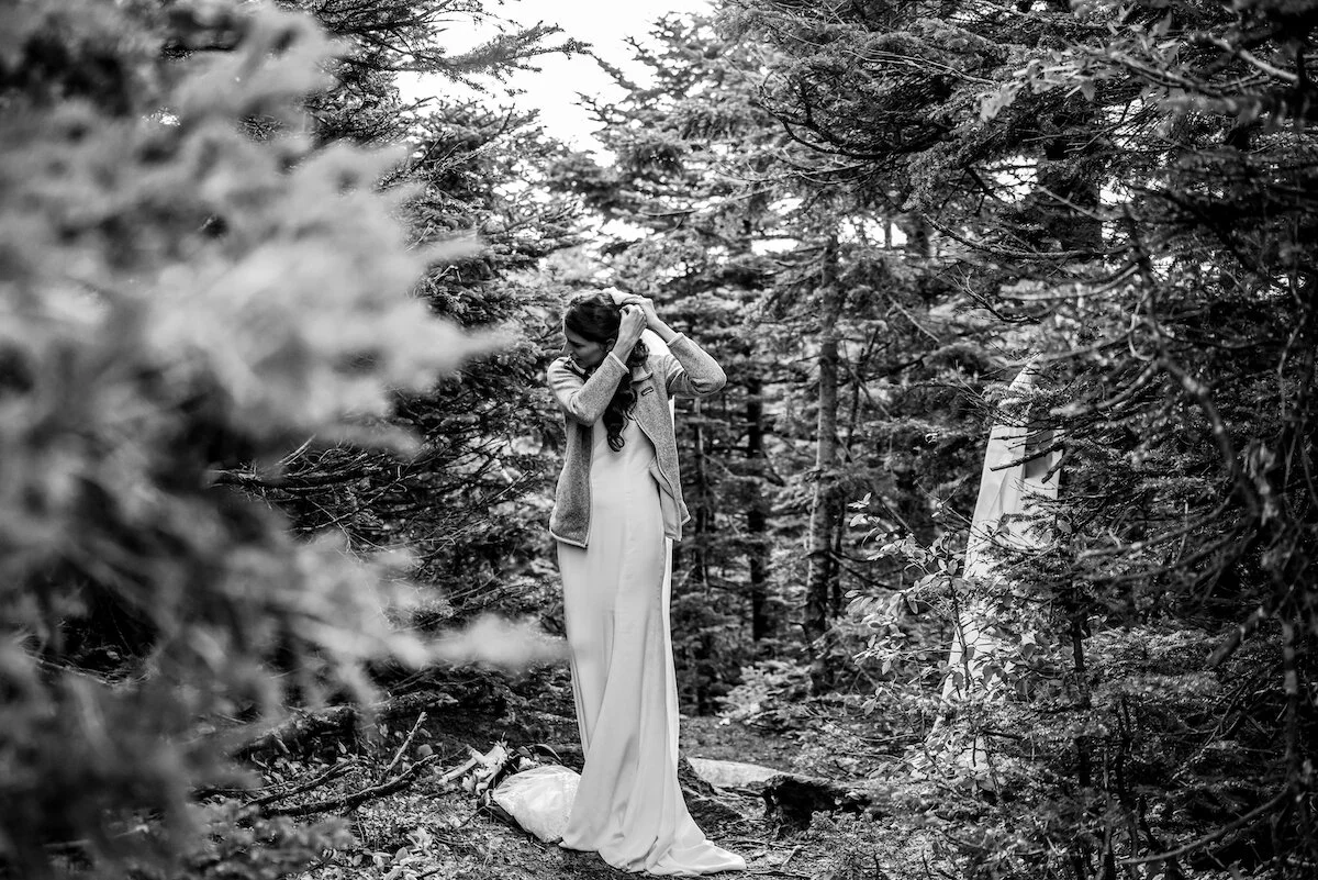 Bride gets ready in mountain forest