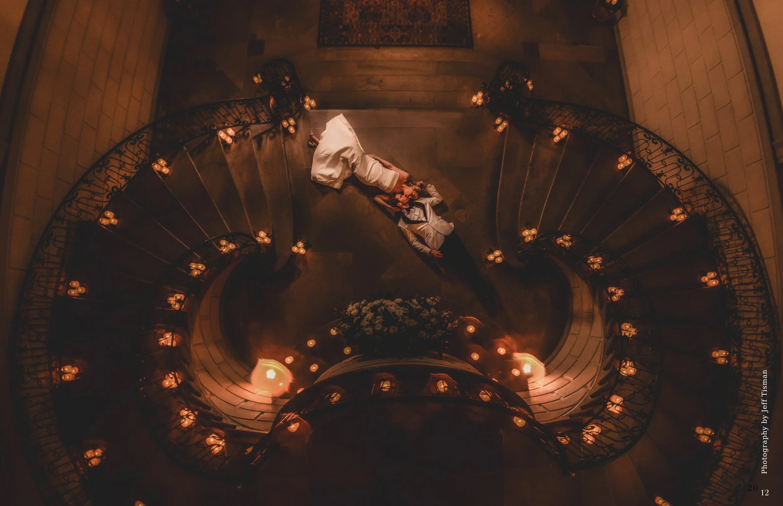 wedding couple laying on the ground grand staircase
