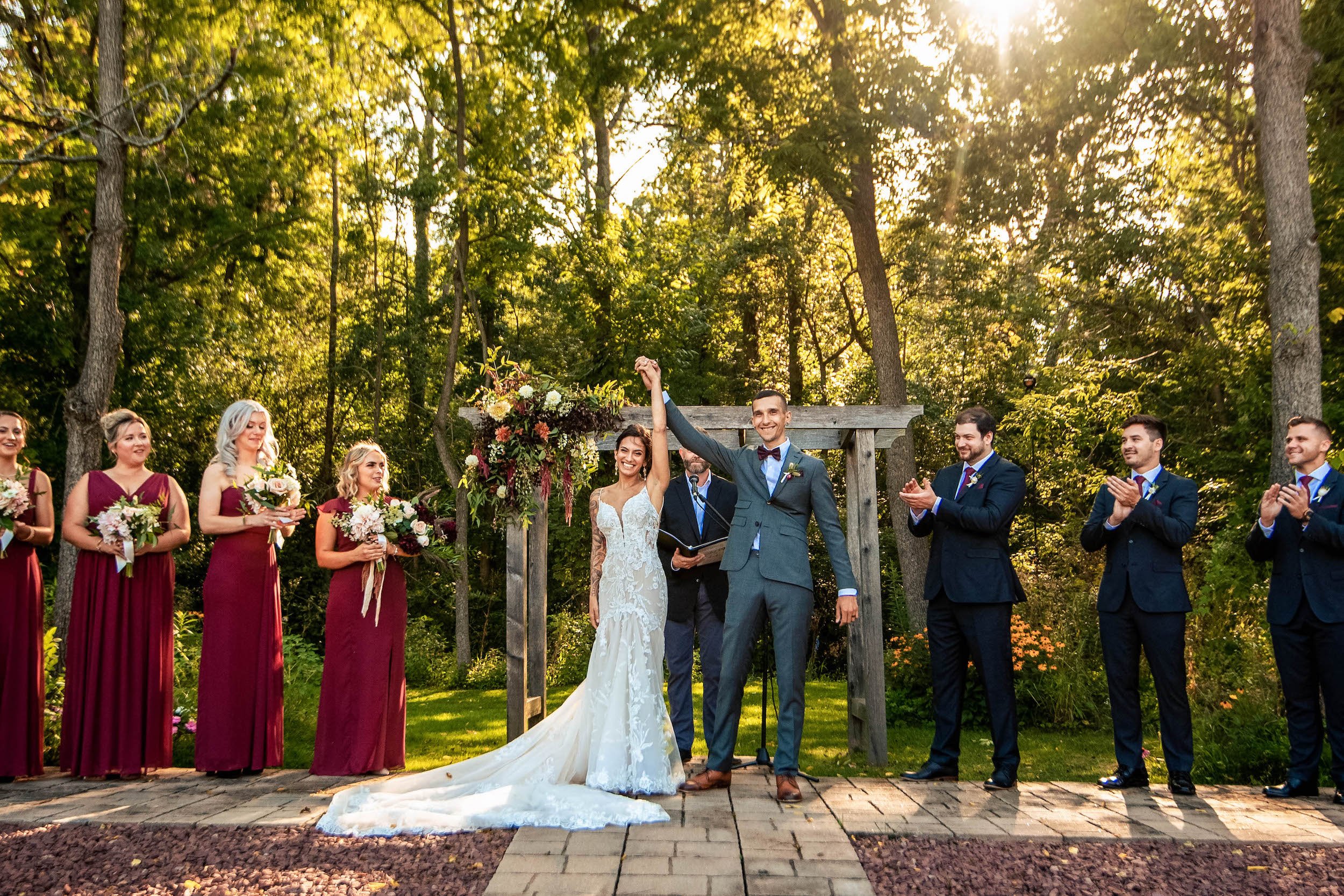Bride and groom pose before walk down the aisle as married couple