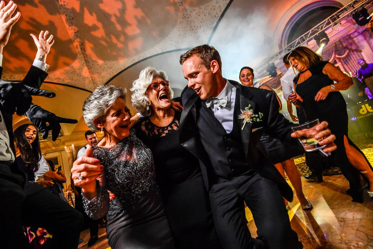 Groom dances with family