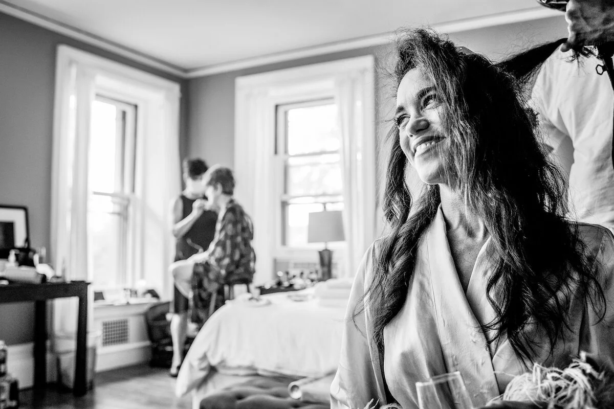 Bride gets hair done by hair stylist