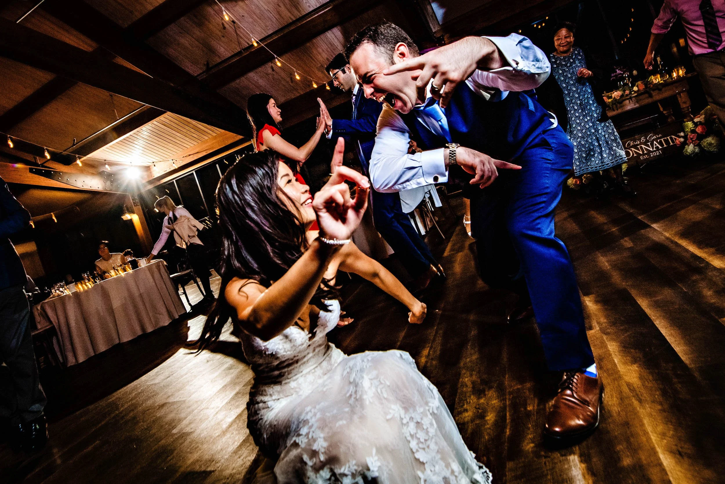 Bride and groom have fun on dance floor