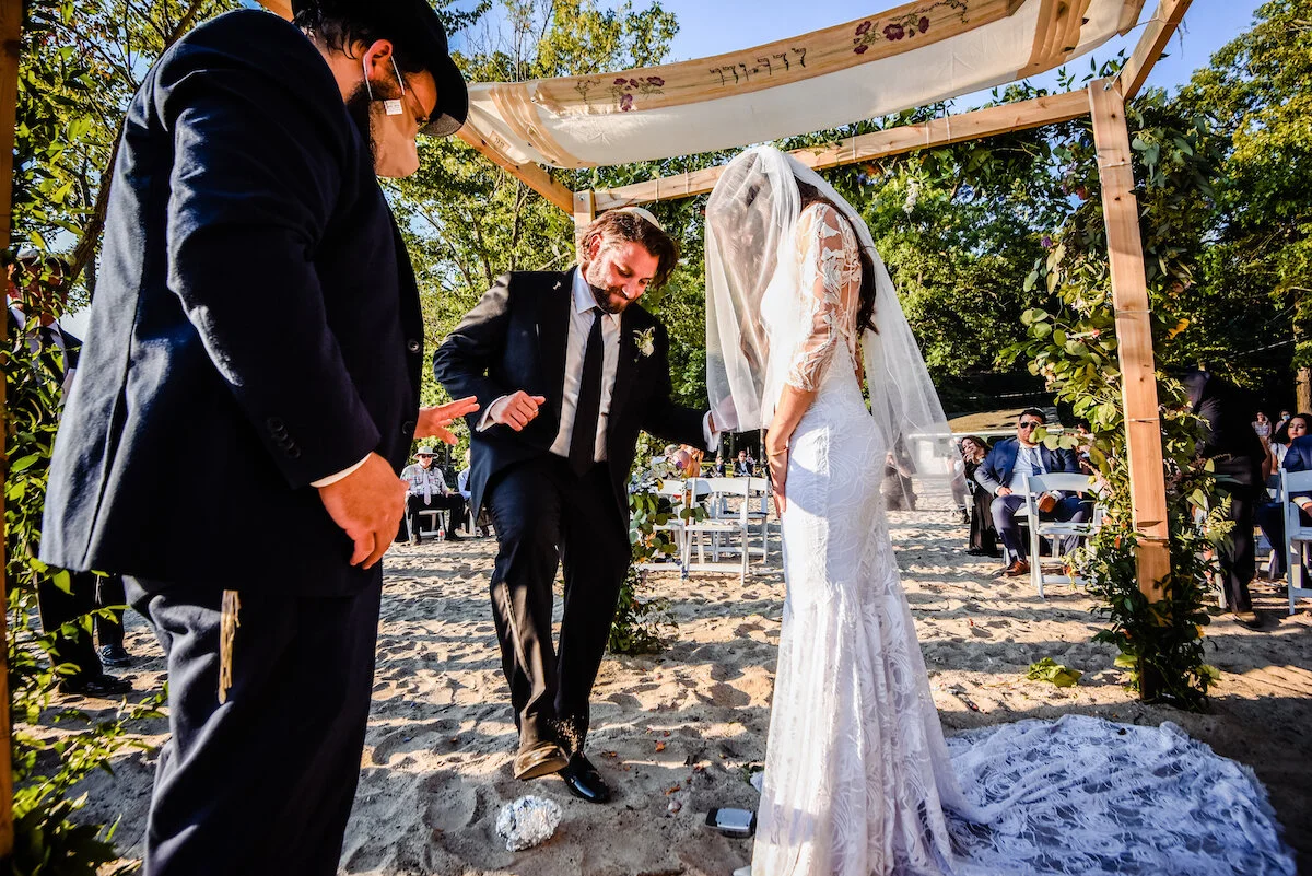 Groom stomps on glass in traditional Jewish wedding tradition