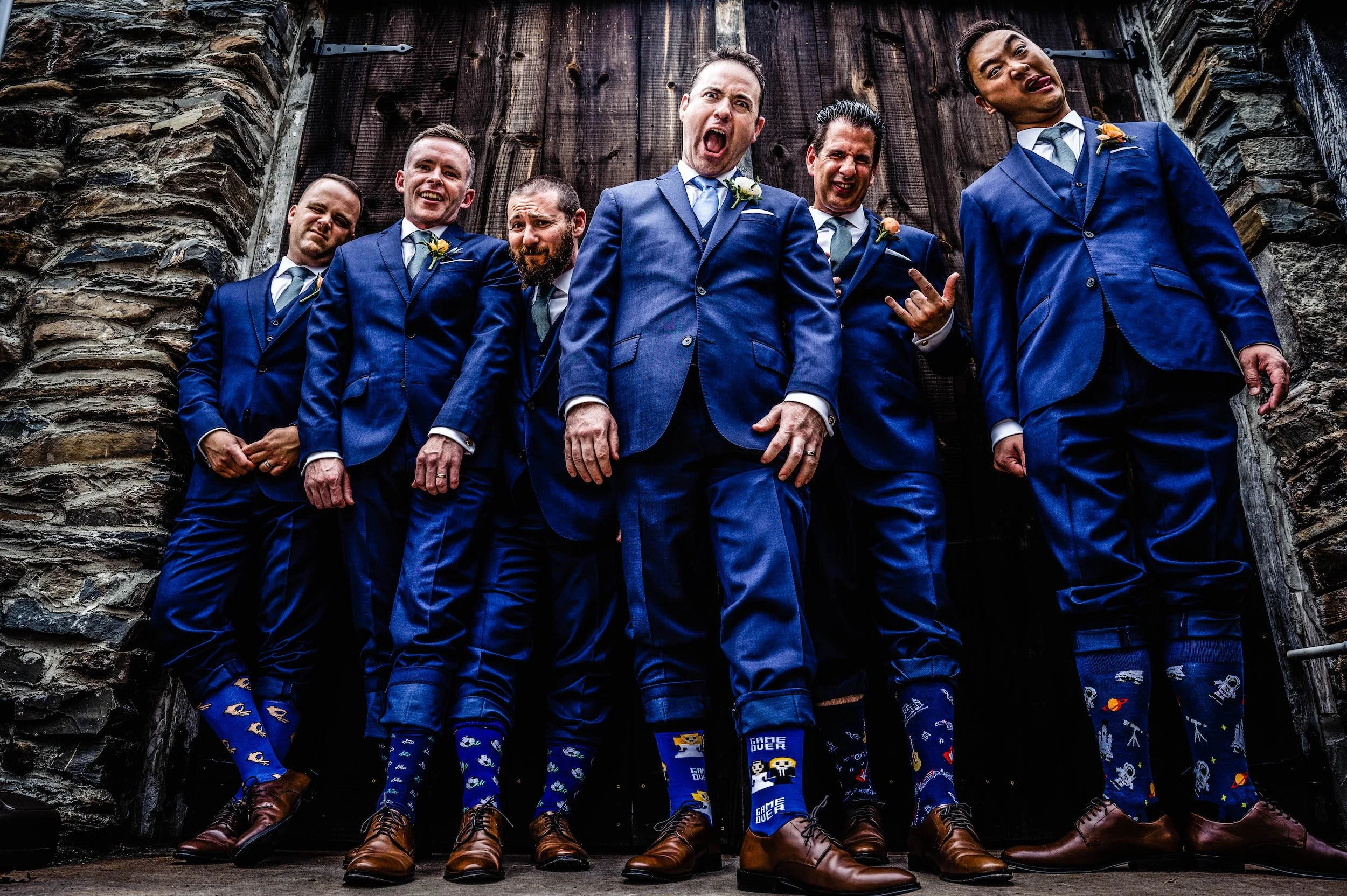 Groomsmen pose with silly faces