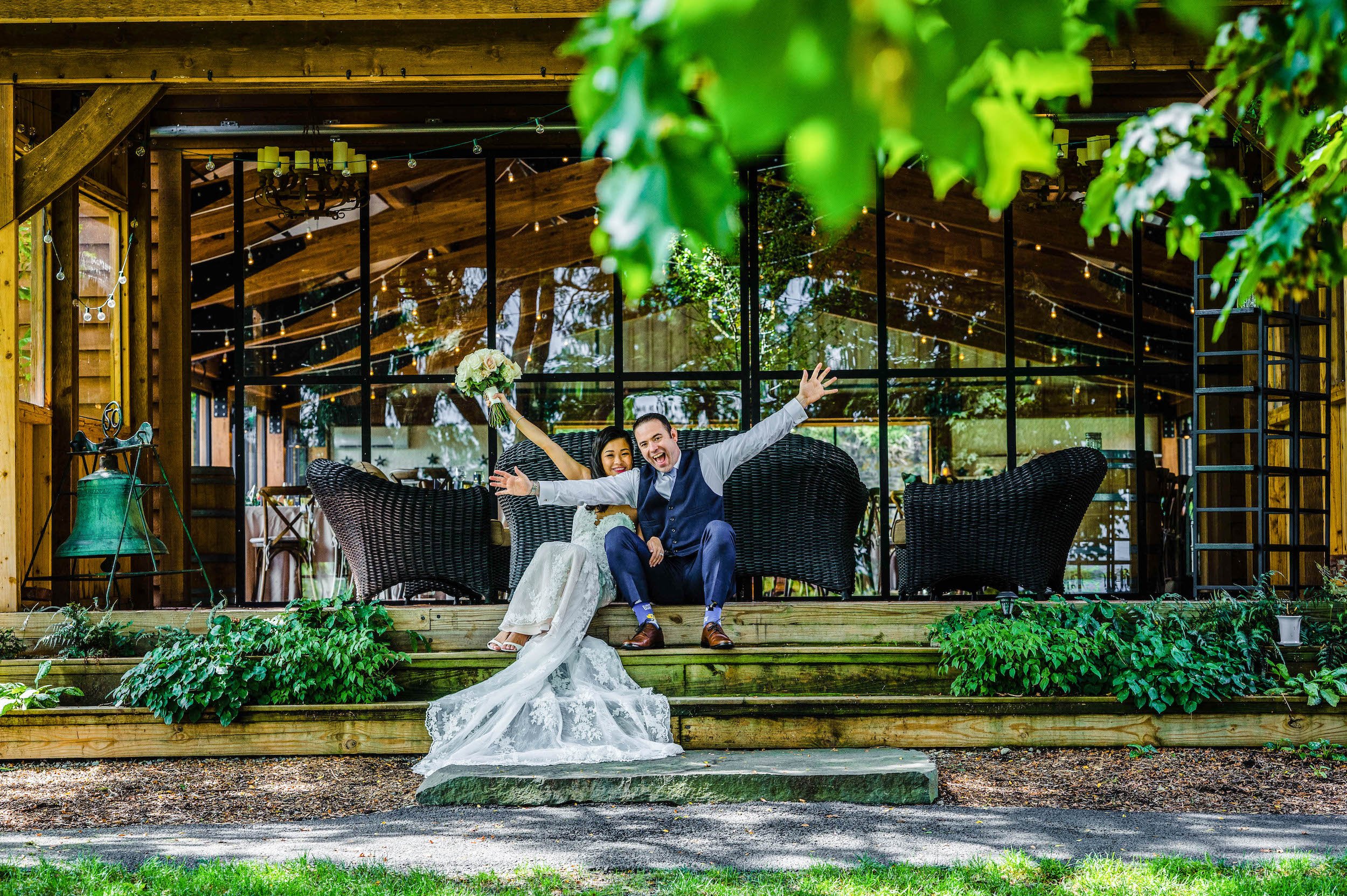 Bride and groom celebrate outside of venue