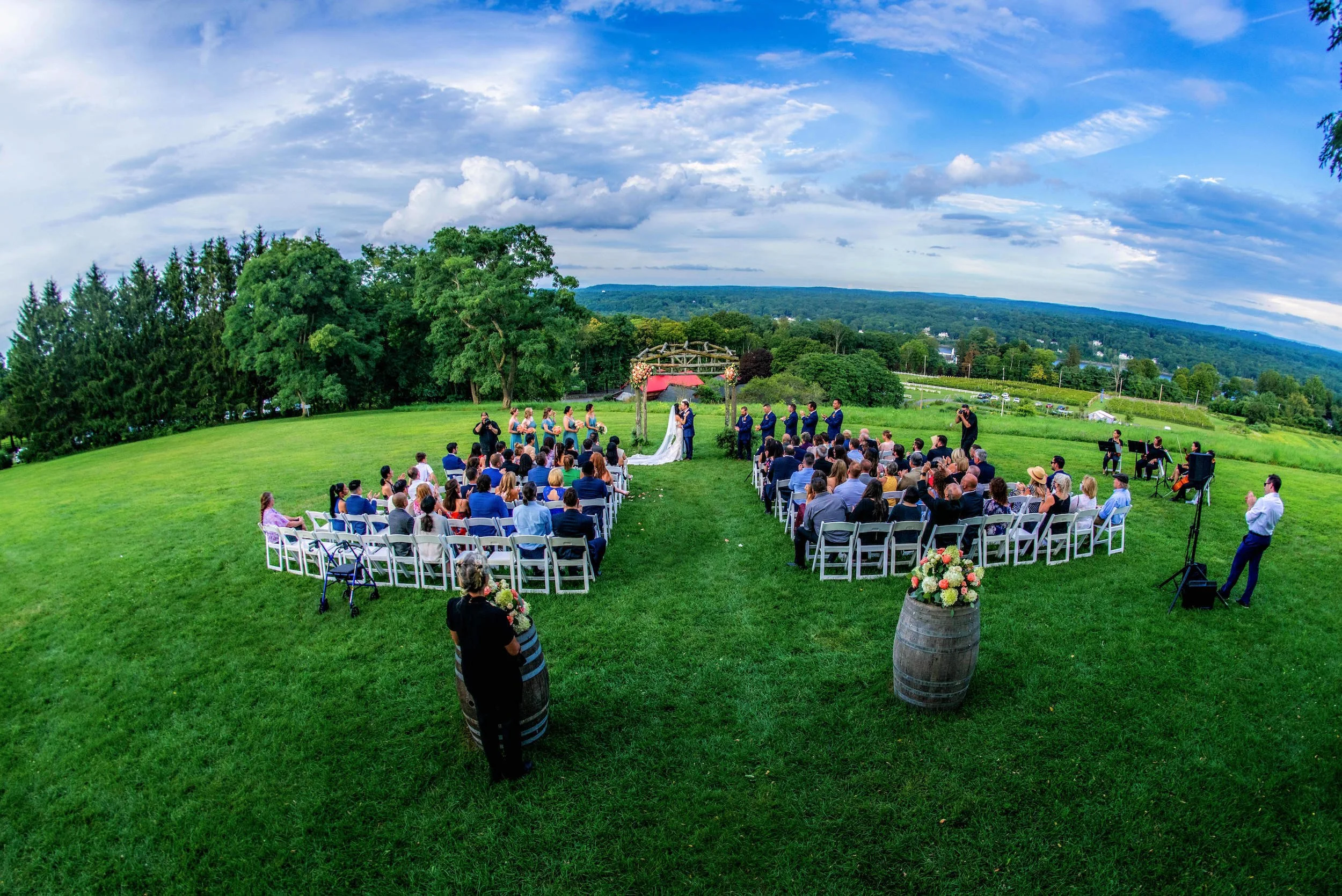 Drone view of wedding ceremony blue skies