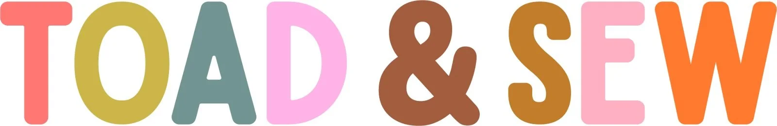 Colorful text that reads 'TOAD & SEW' with each letter in a different bright color.