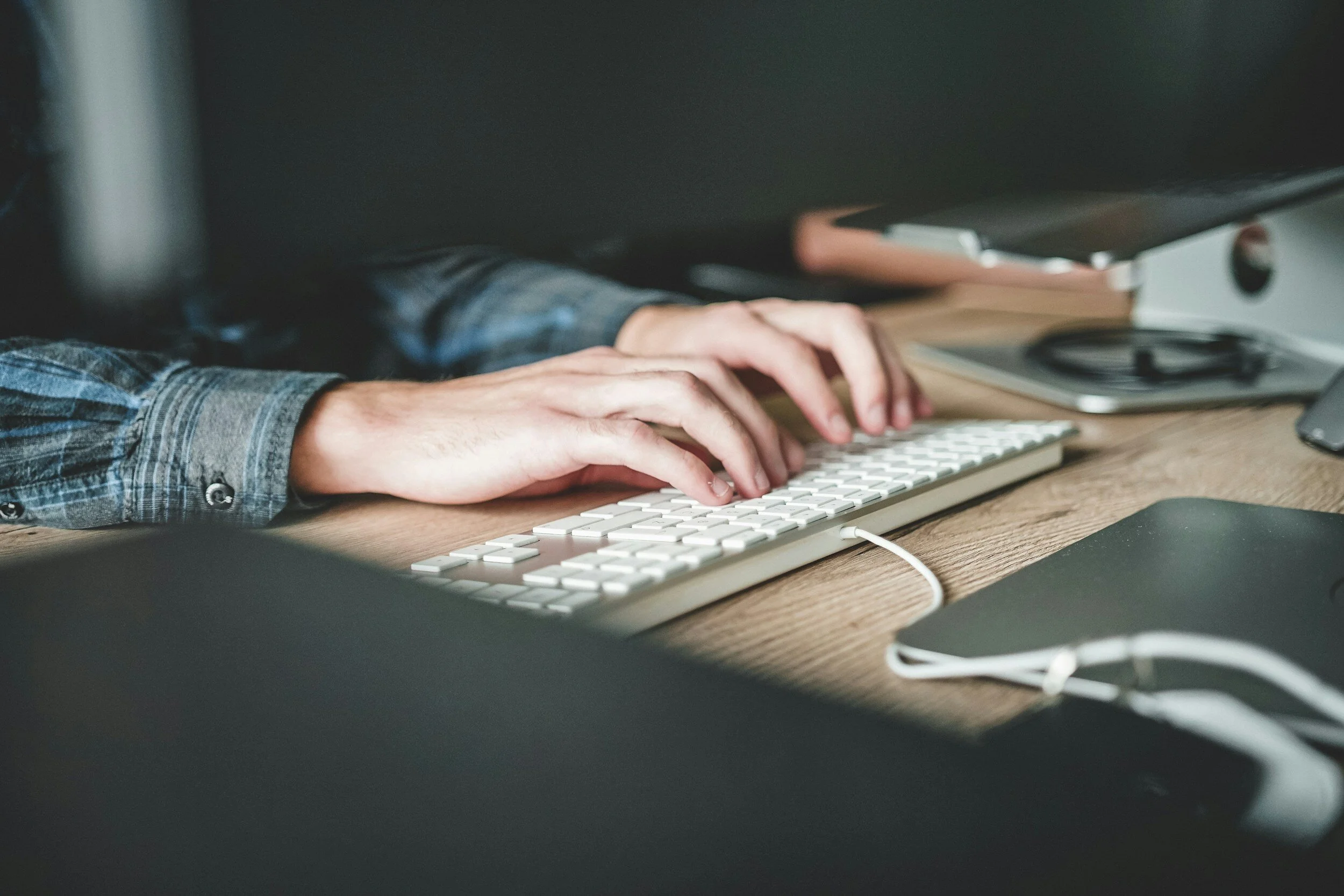 A person working at a keyboard.