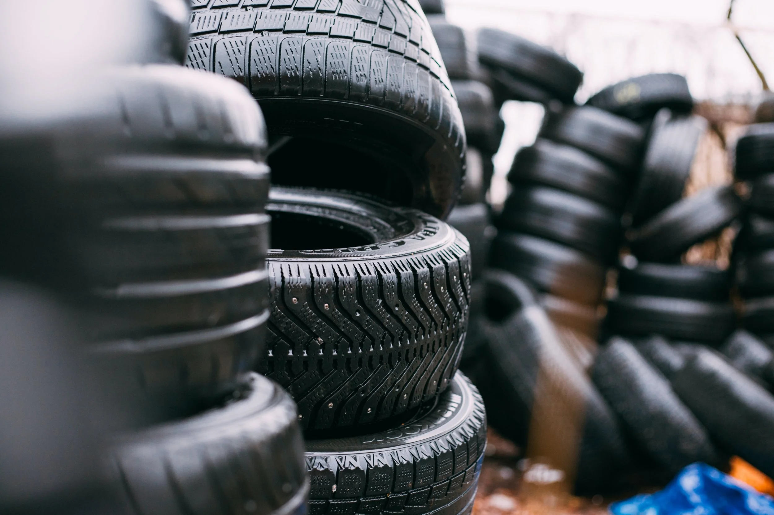 Tires stacked on top of one another.