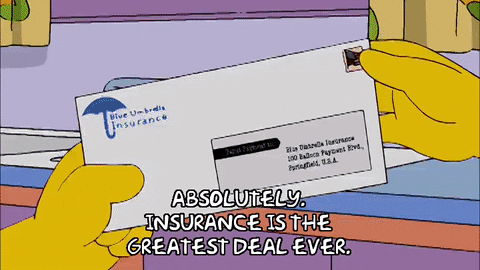 Homer Simpson sitting at a table in his kitchen - he takes an envelope and says, "Absolutely, insurance is the greatest deal ever."