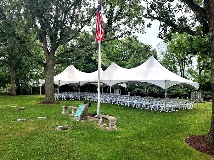 Tent rental setup by DuPage Tents & Events in Chicago Illinois featuring large white event tent for outdoor wedding reception