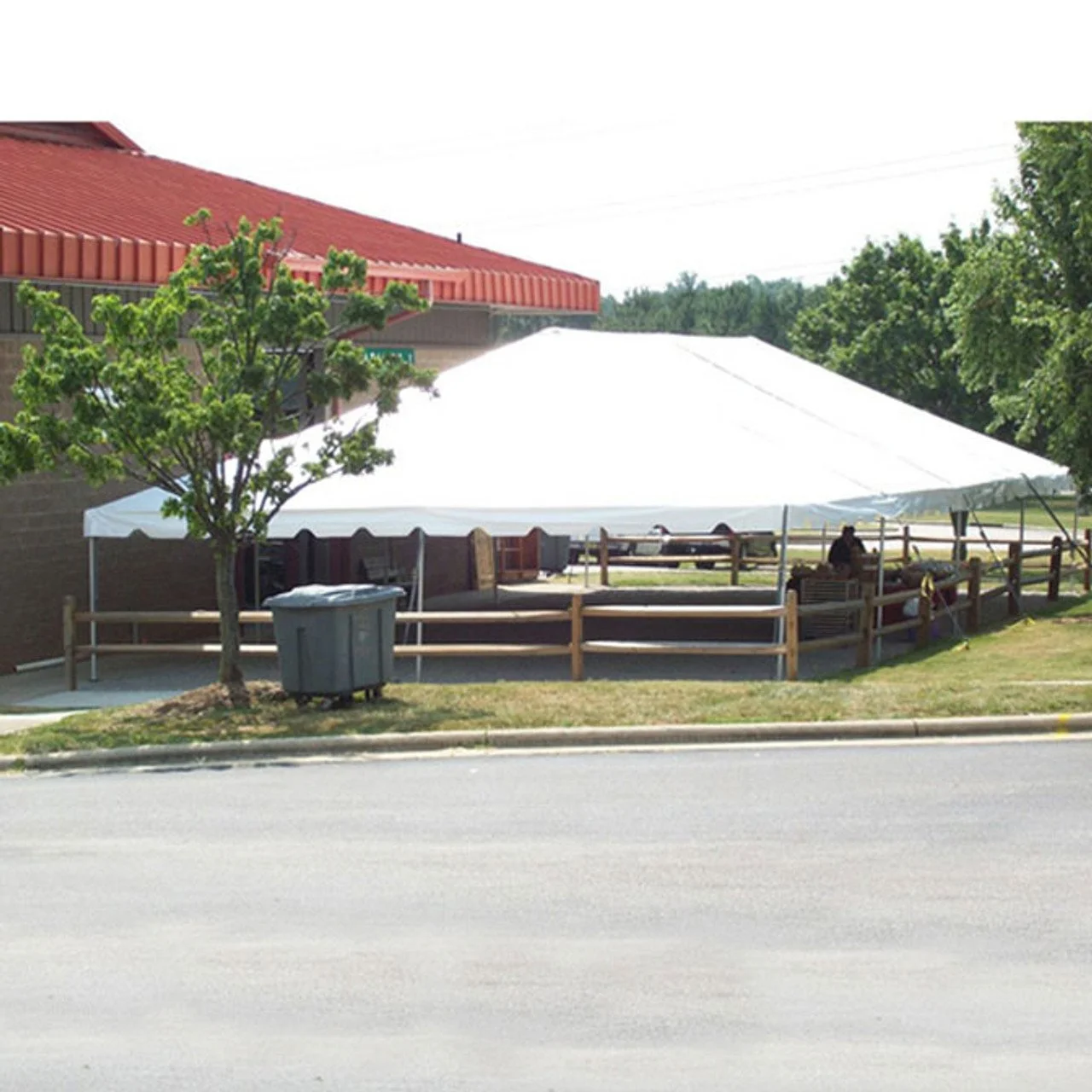 30x60 large party tent rental installed near building for outdoor event