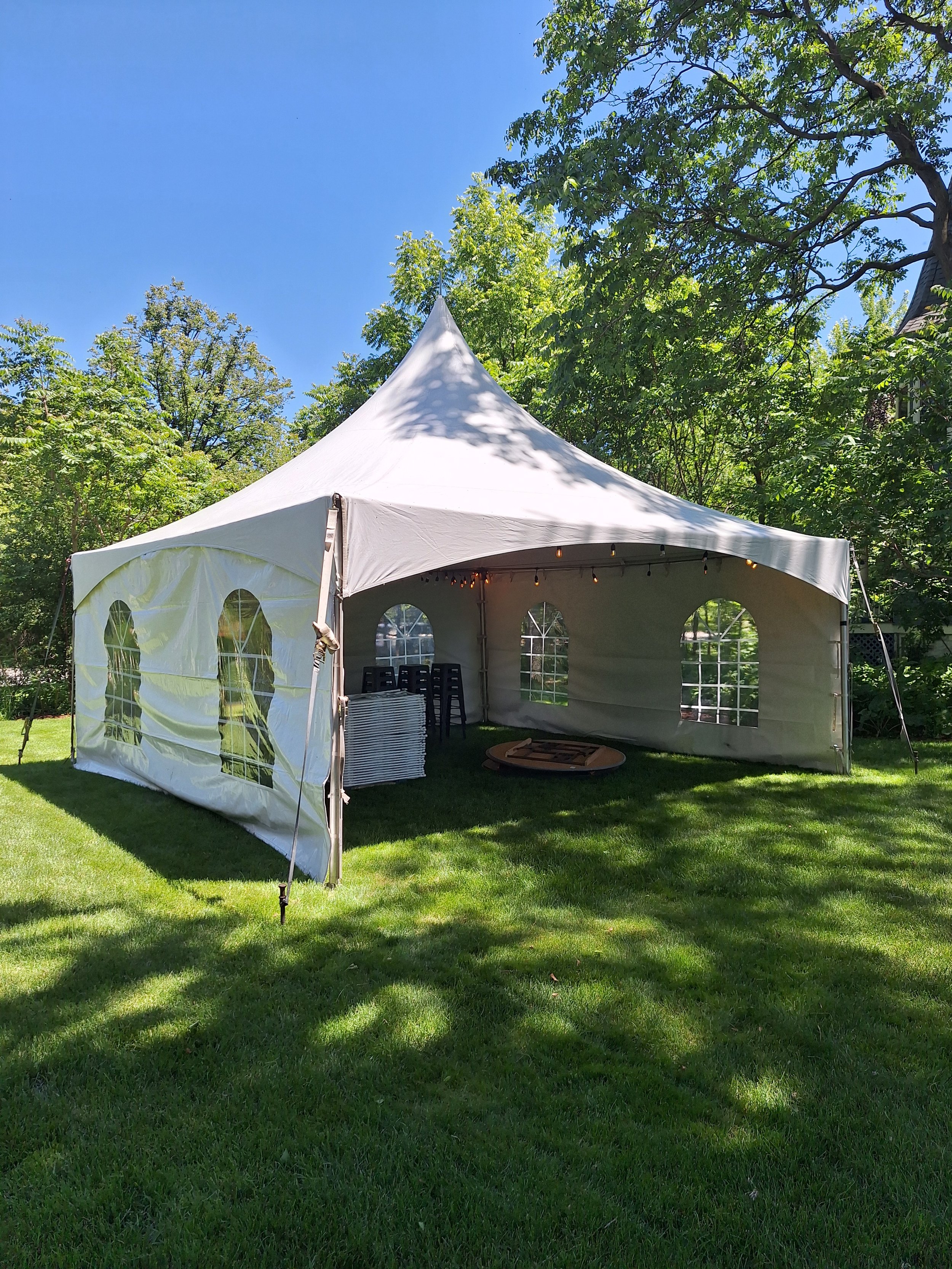 Tent rental with solid sidewalls for rain and wind protection