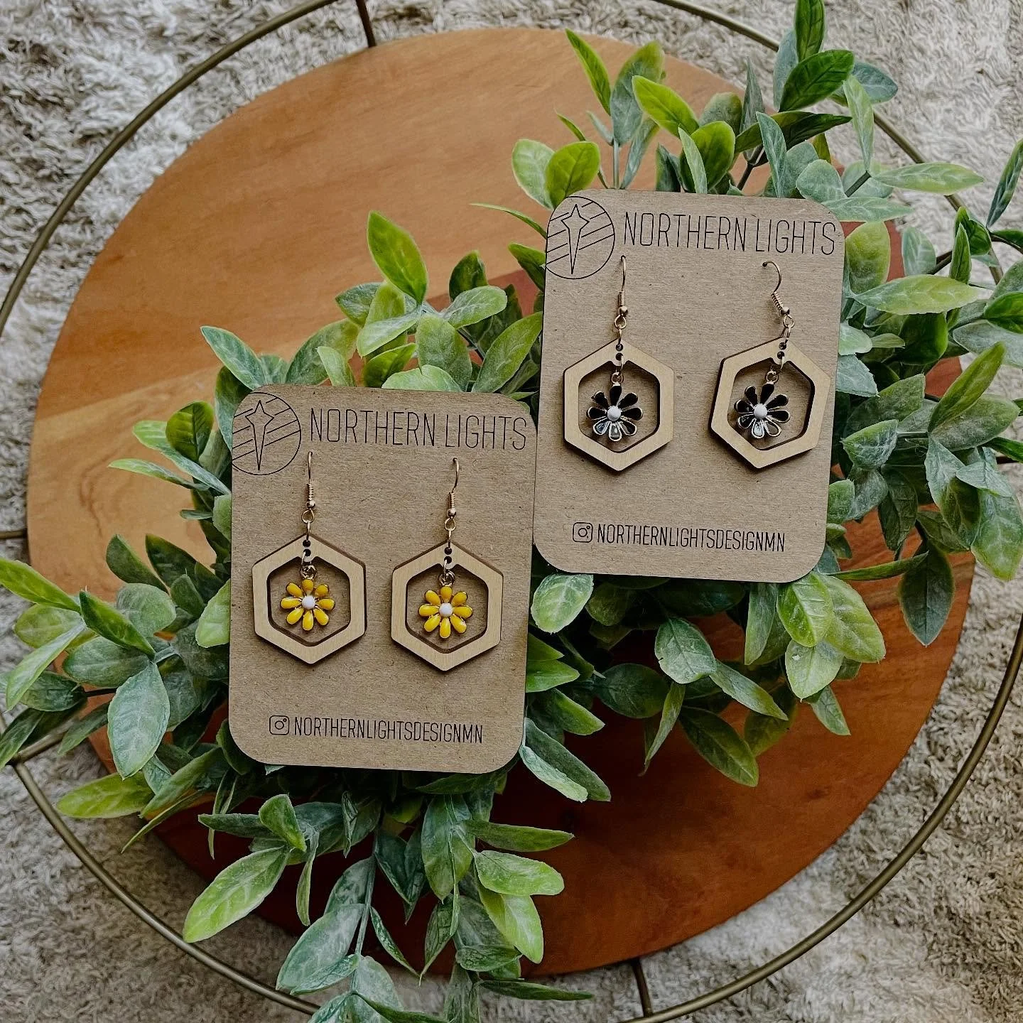 Bring a little summer flare to your fall wardrobe 🌼 🖤
.
.
.
. 
#shopsmall #shoplocal #mnmade 
#minnesotamaker #northernlightsdesign #smallbusiness #lasercut #mnlove #xTool #xToolmade #woodworking #makersmarket #statementearring #woodenearrings