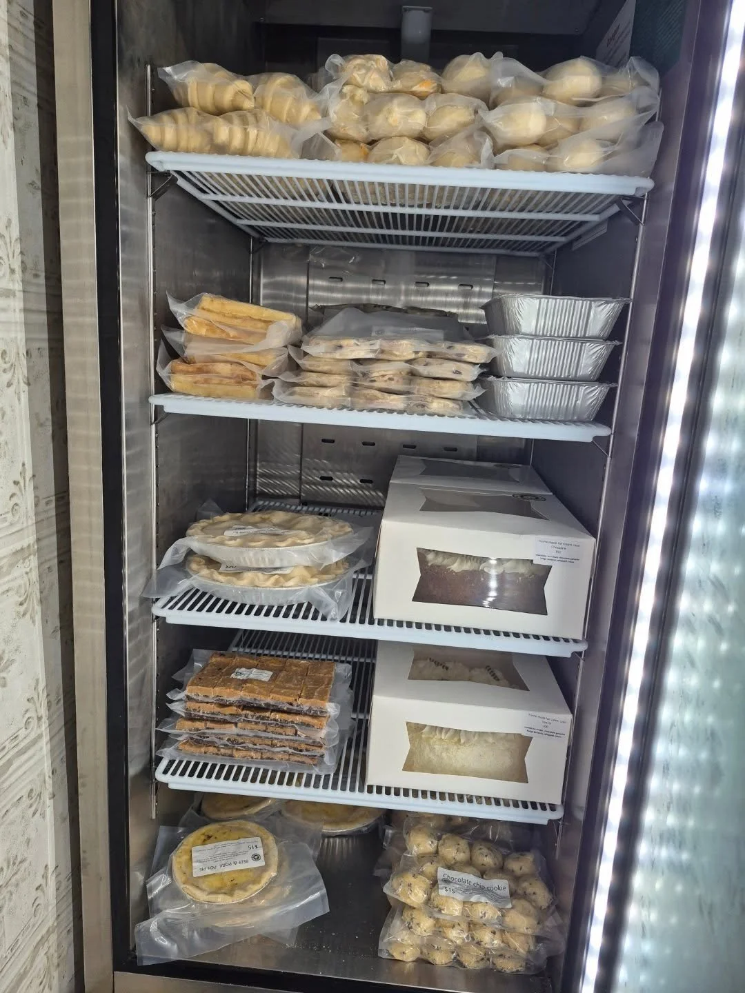 Good morning! 
Our freezer is full of goodies you can enjoy at home! 
Ice cream cakes, sourdough toaster waffles, pies, scones, croissants, buns, gluten friendly squares , cookie dough and cinnamon buns! 
Its still considered home made if you bake it