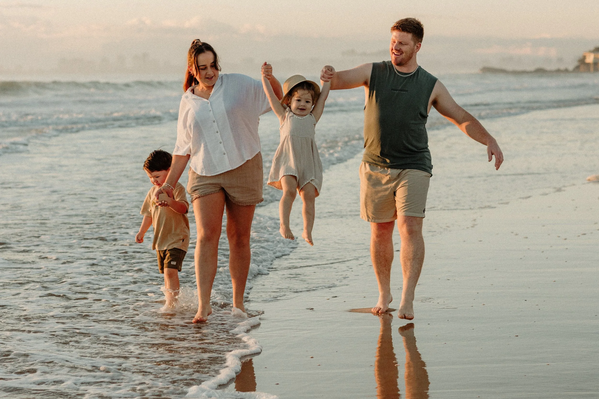 family on ocean candid photoshoot
