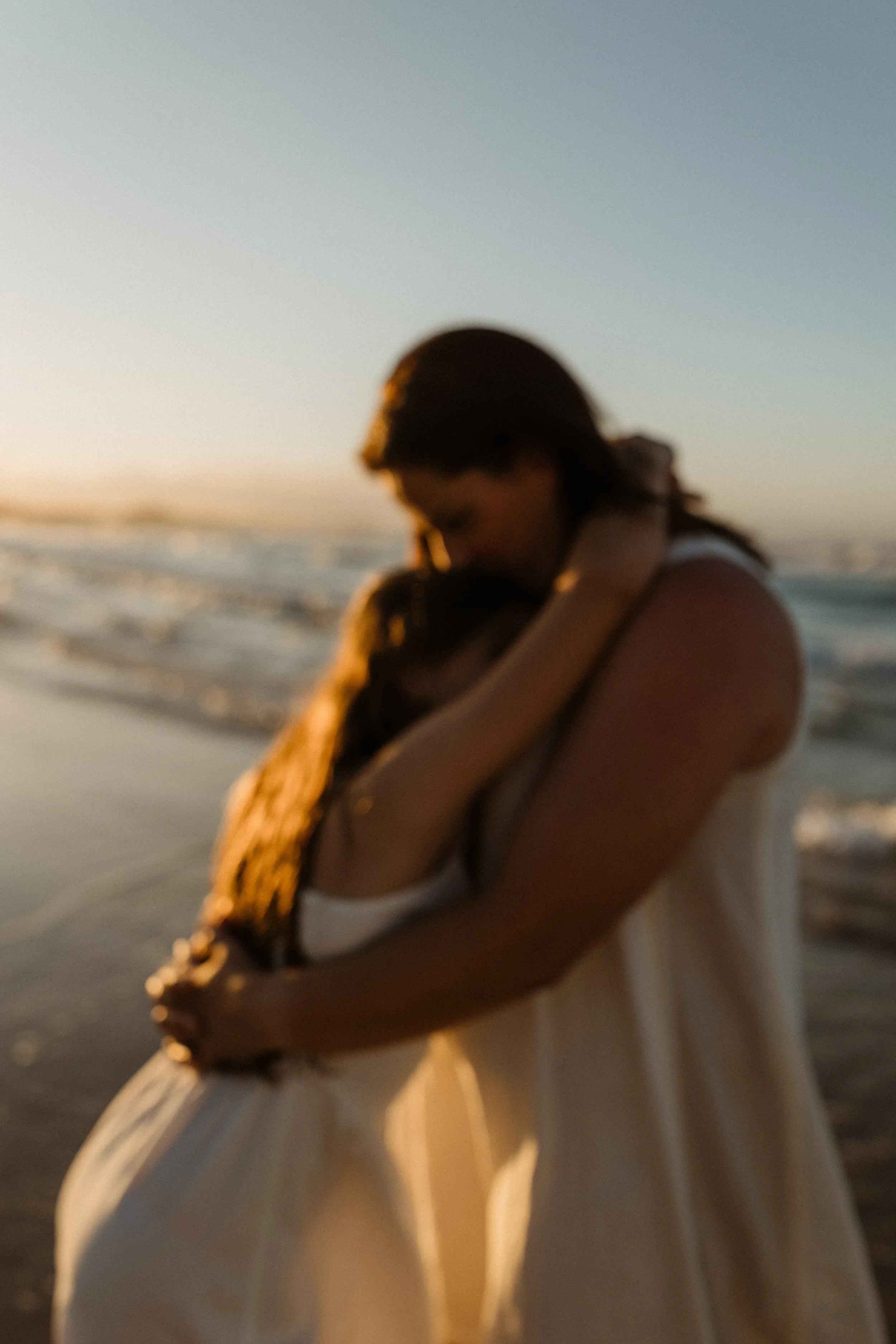 creative mum and daughter beach hug photo