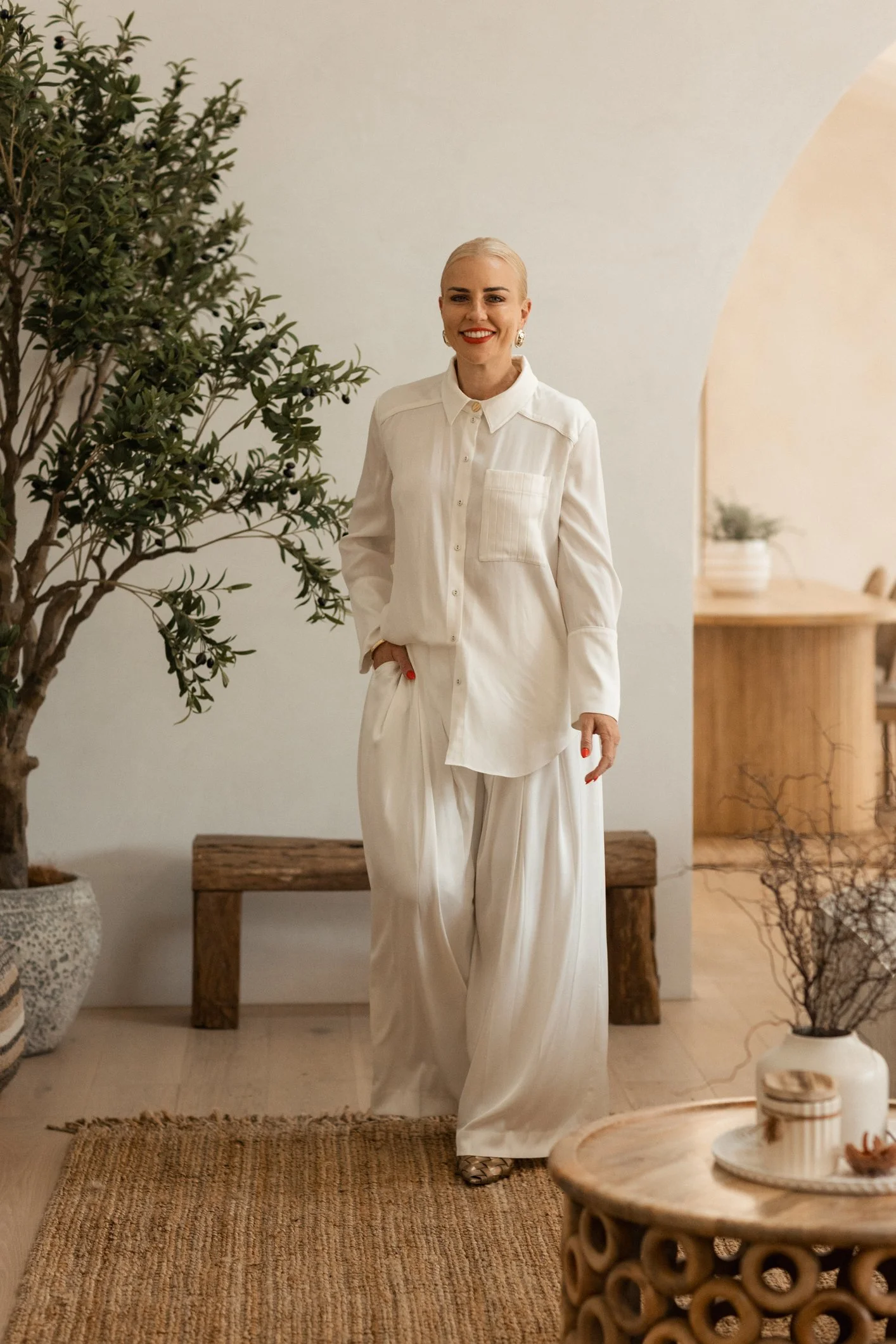 white linen outfit blonde lady walking in house gold coast