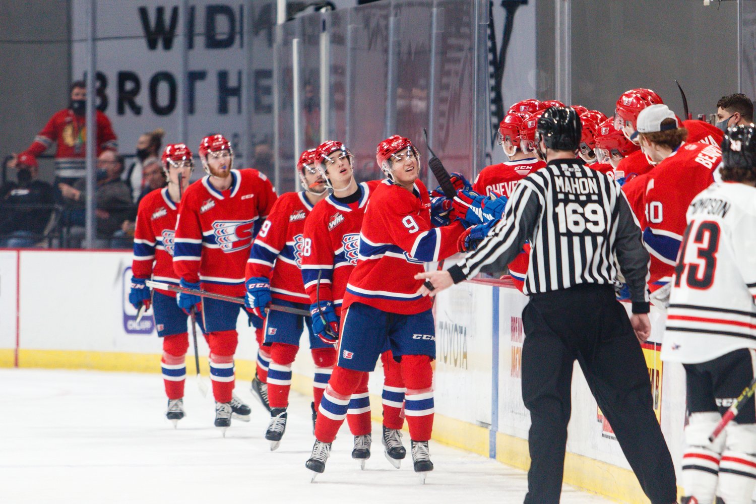 Bear Hughes and the Spokane Chiefs celebrate a goal