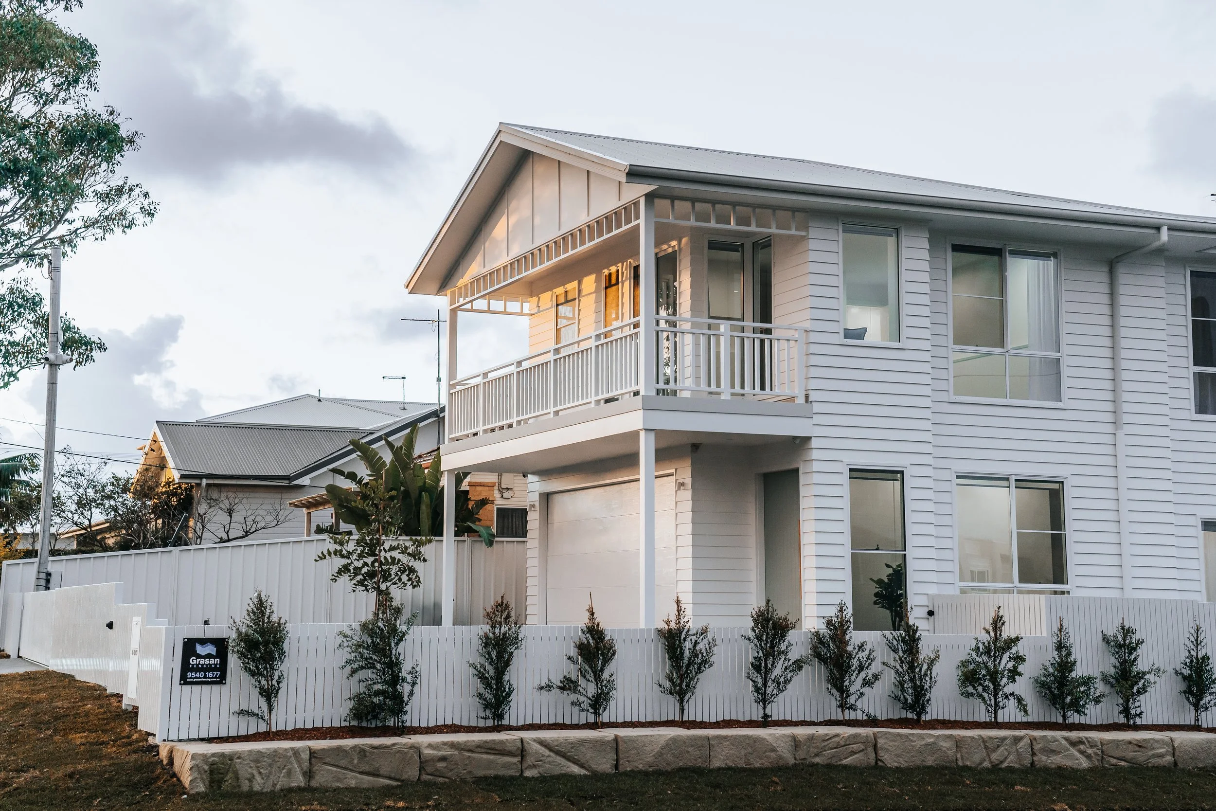 Front façade of Hamptons-inspired duplex at 36 Oaks Street, Cronulla by Ambient Constructions