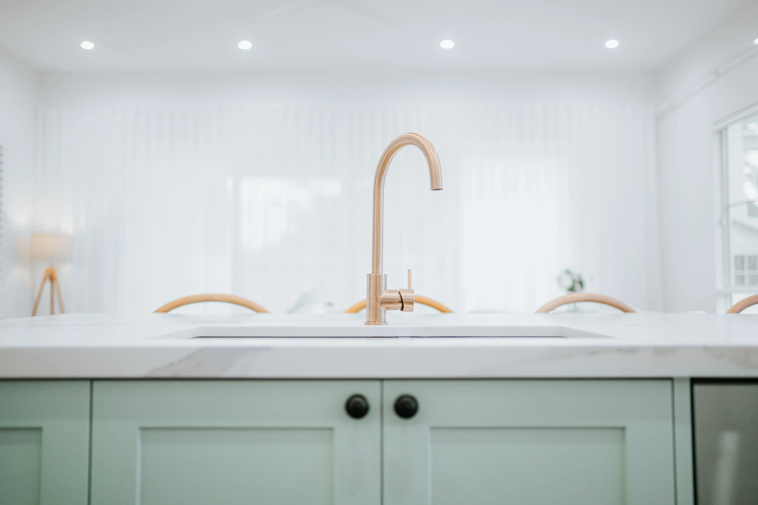 Coastal-inspired bathroom vanity with brushed gold tapware in Cronulla duplex