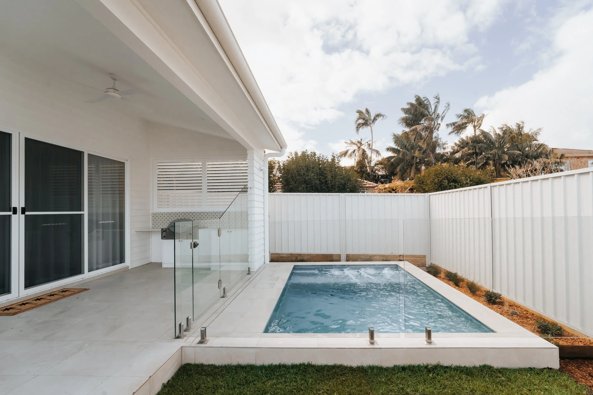 Backyard swimming pool with white Hamptons-style fencing at 36 Oaks Street Cronulla