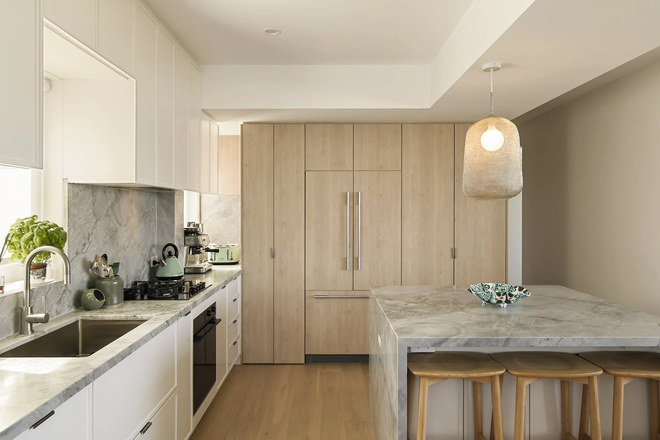 Living room with ocean outlook, built-in shelving and custom seating