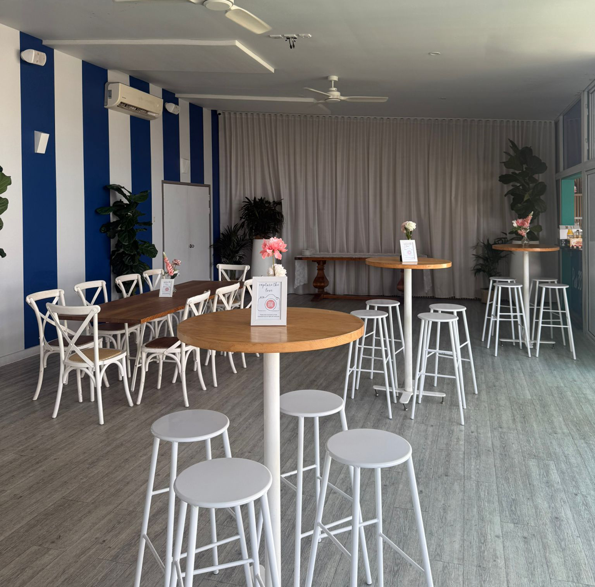 Waterfront Picket Room at Pier 33 set for an intimate wedding reception with marina views