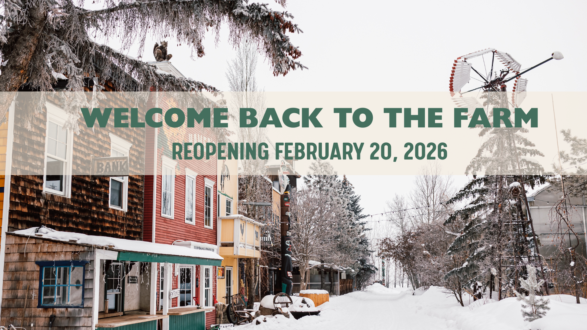 Snow-covered rustic buildings and trees on a farm, with a welcome banner overlay that reads 'Welcome Back to the Farm, Reopening February 20, 2026'.