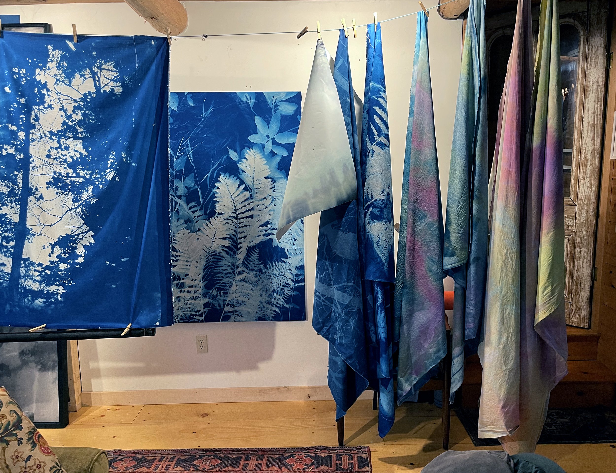 Cyanotype murals on fabric hanging in studio on Peaks Island. 