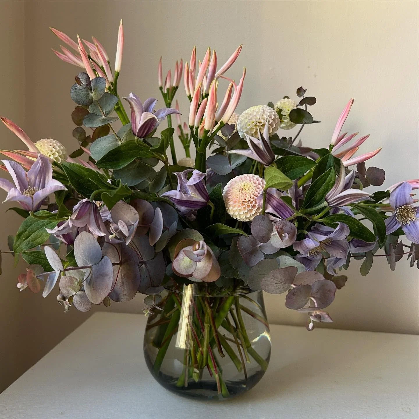 Quiet palette 

Eucalyptus from @sealpointfarm and &lsquo;Small World&rsquo; Dahlias from @carolyn.snell via @maineflowercollective with imported Clematis and Nerine Lilies